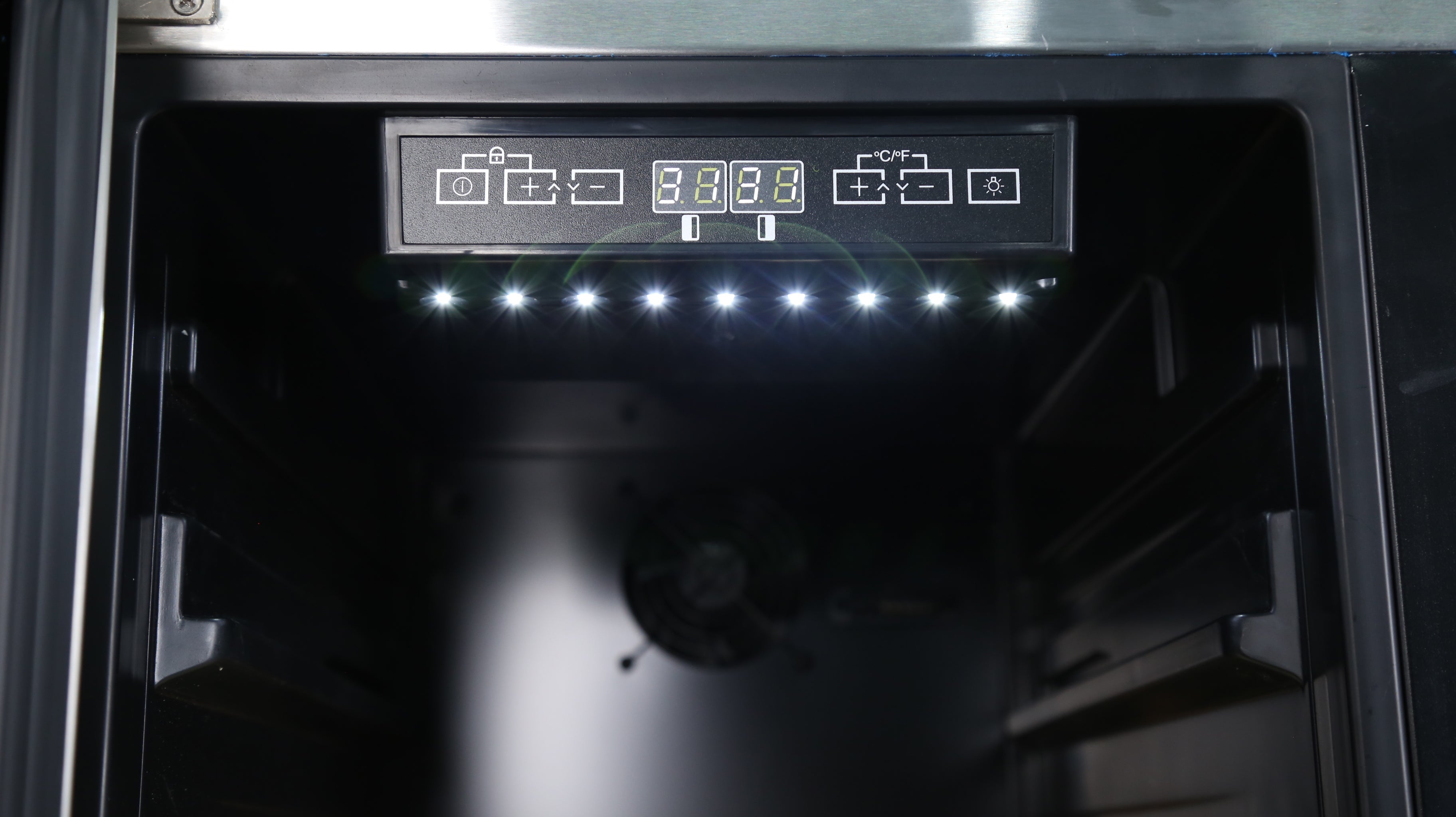 Close-up view of the interior space of a 6.3 Cu Ft Wine Outdoor Refrigerator With Single Tap Kegerator, focusing on the digital temperature control panel