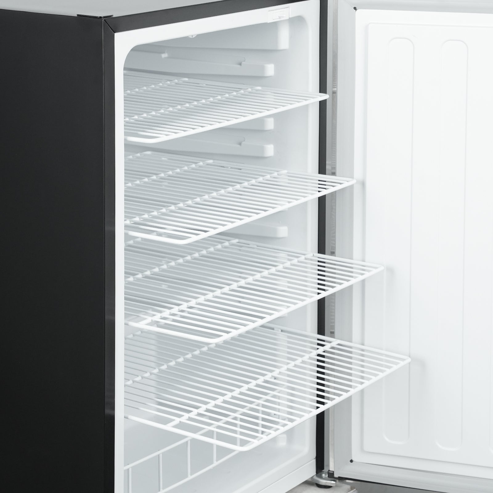 Close-up view of a 4.1 Cu Ft Stainless Steel Outdoor Beverage Fridge 156 cans with the door open, showcasing four wire shelves arranged in a way that highlights their adjustable feature