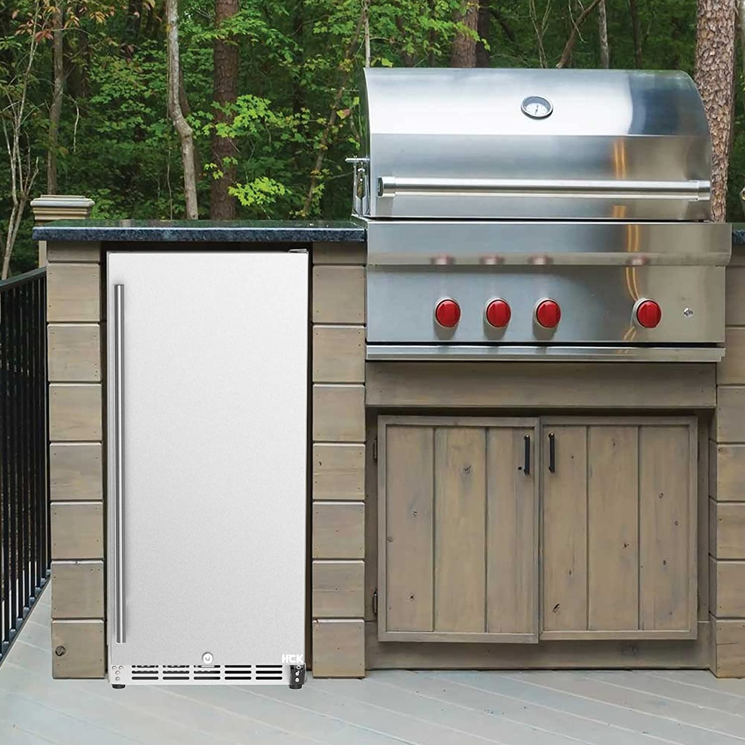 Front view of an outdoor barbecue setting with a 3.2 Cu Ft Black Outdoor Beverage Fridge 96 cans installed beside a barbecue grill
