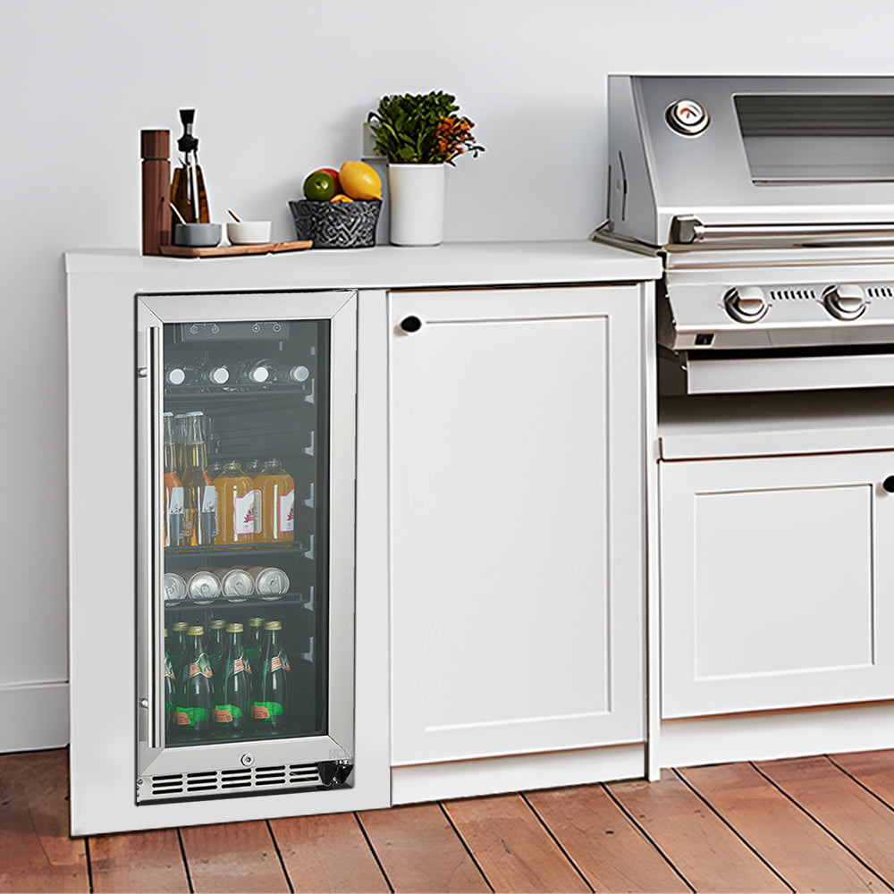 Side view of a barbecue setting with a 3.2 Cu Ft Compact Beverage Outdoor Refrigerator 96 cans installed beside a barbecue grill
